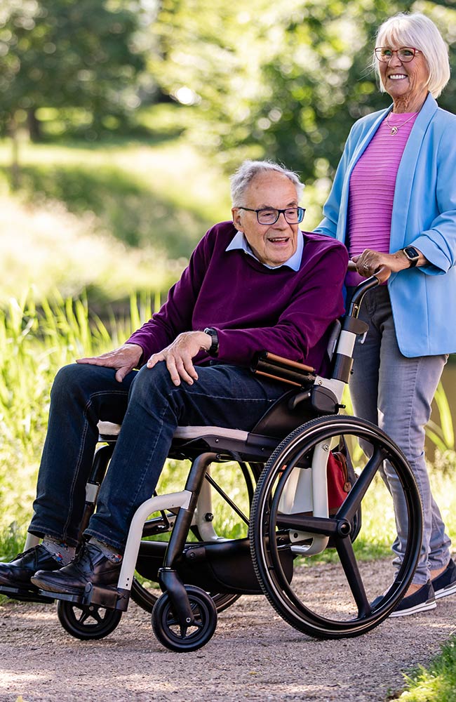 Happy couple enjoying time together with Zoof wheelchair